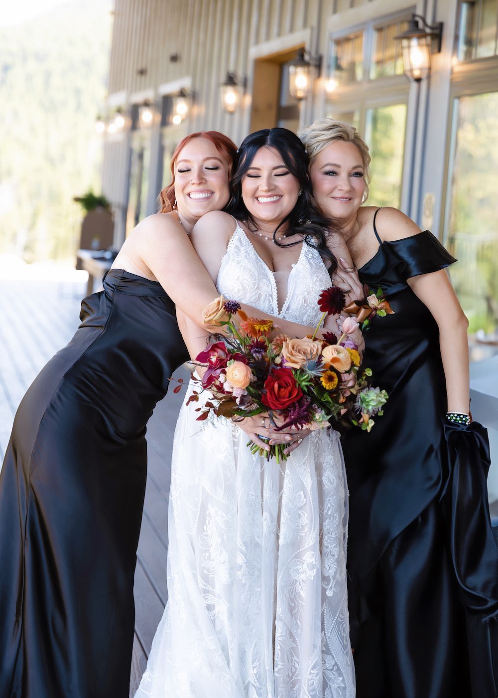 Bride and sister hugging before wedding in Idaho Springs Colorado