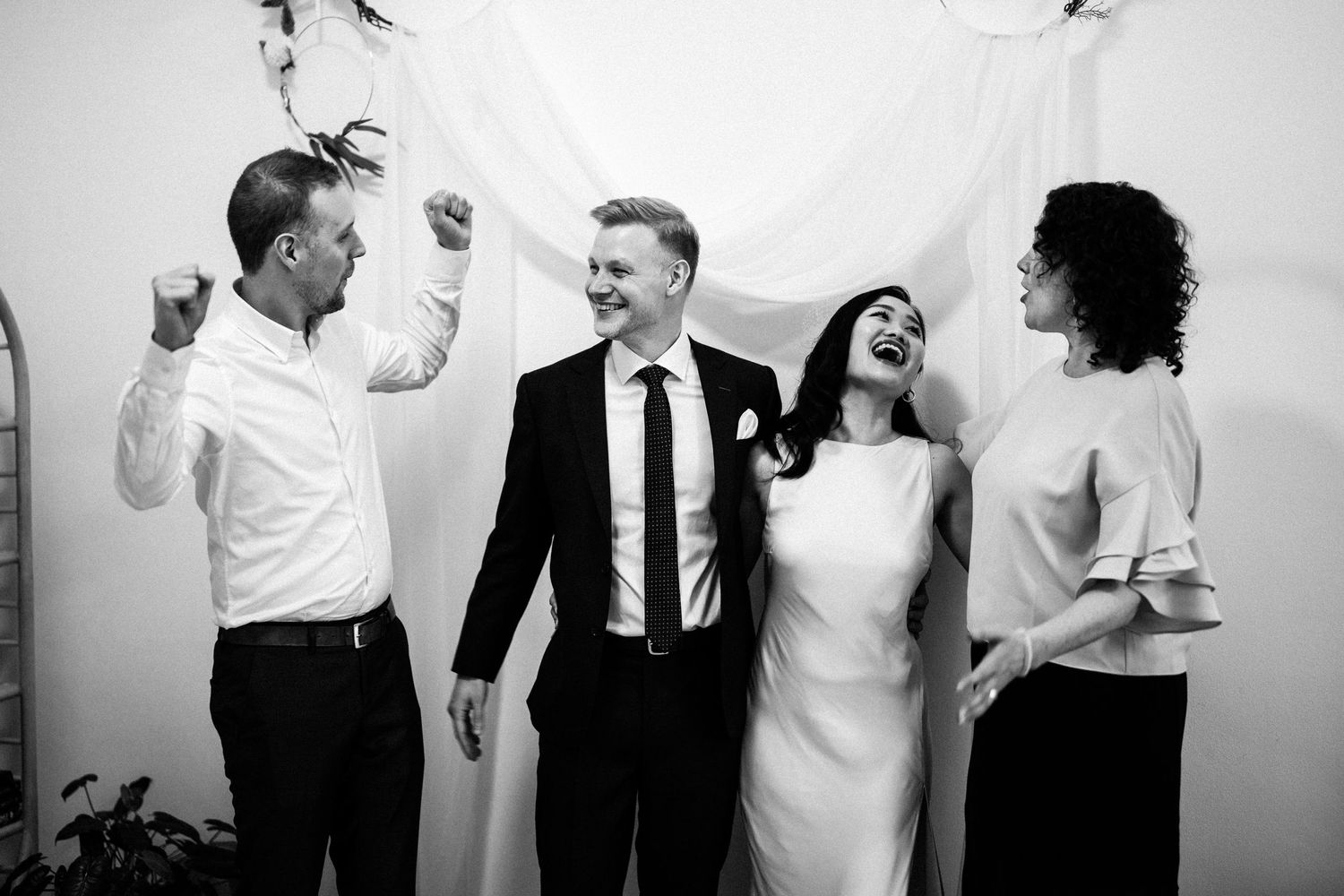 Black and white series of candid wedding moments showing joy and laughter.