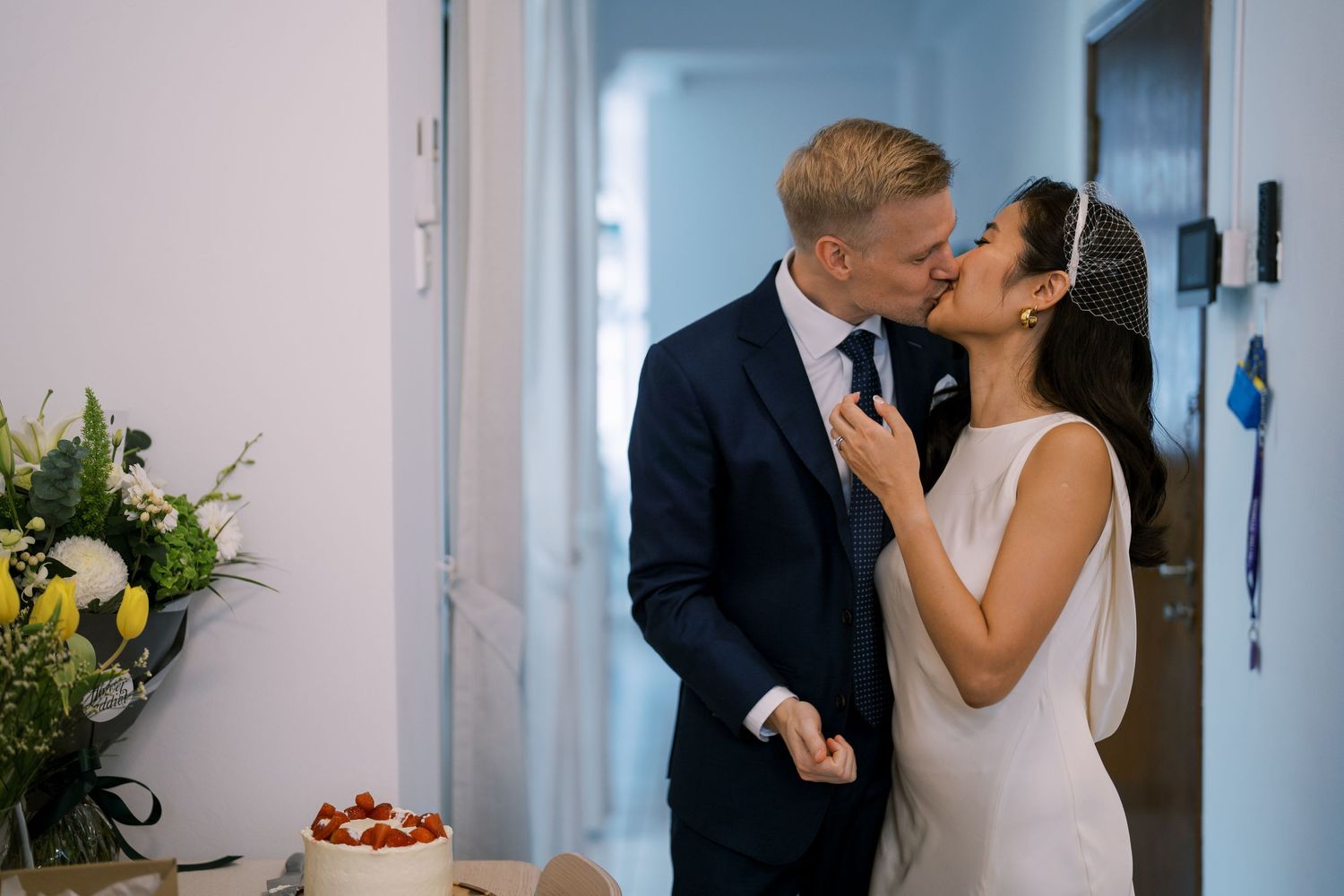 Intimate wedding moments captured in a modern indoor setting with natural light.