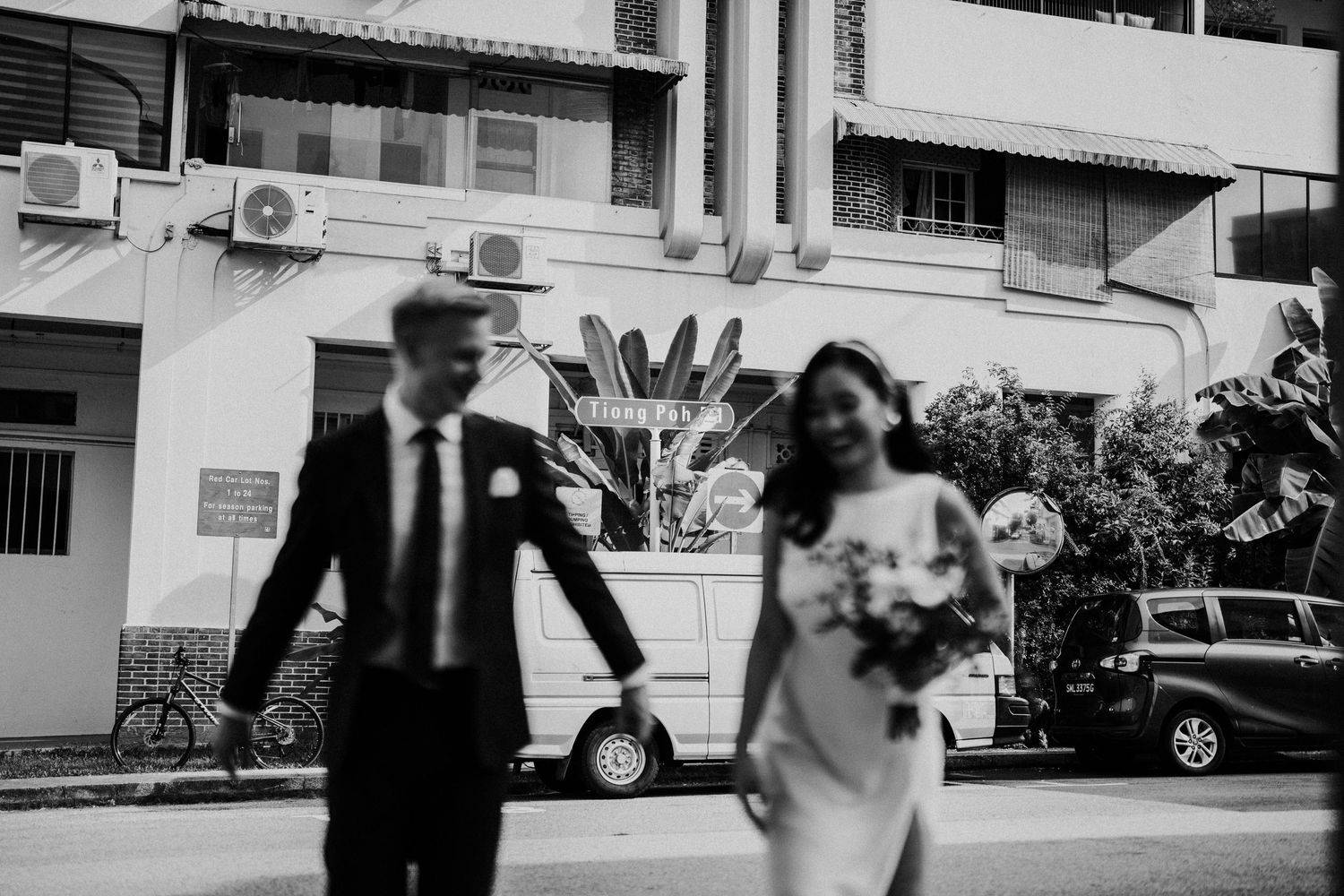 Black and white artistic wedding photos showing romantic moments between newlyweds.