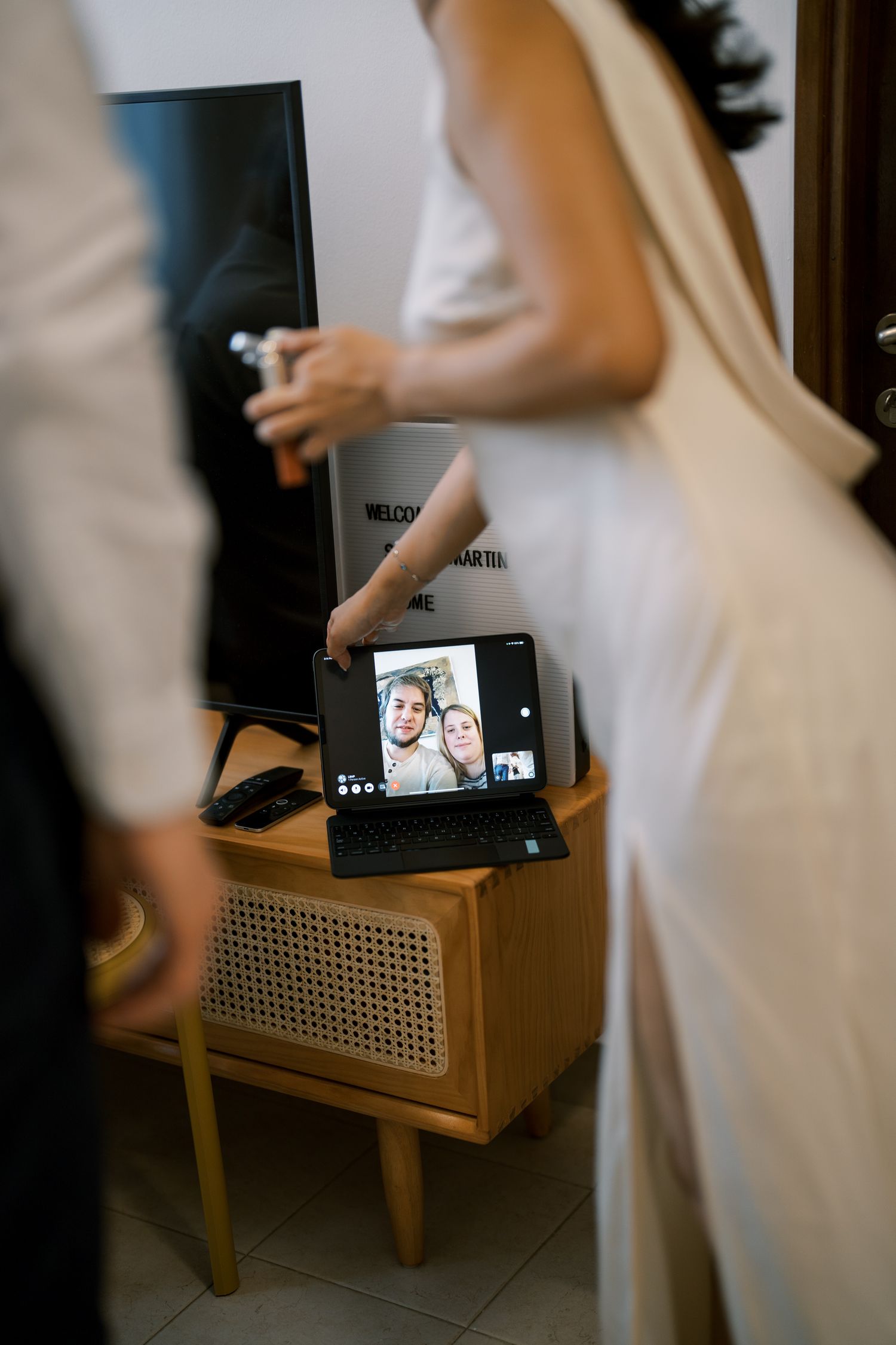 Wedding preparation scene with digital devices and formal attire.