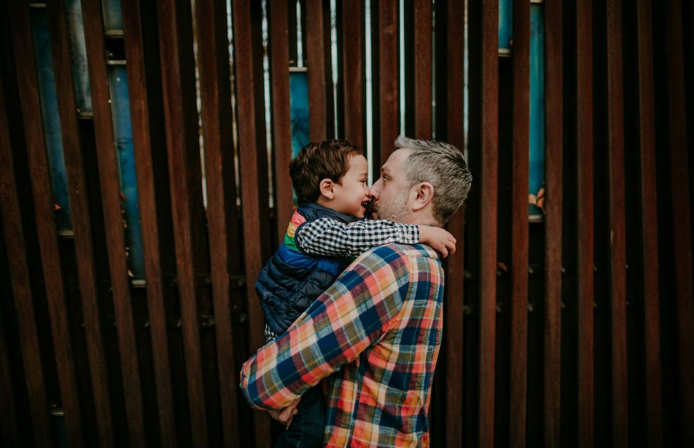 dad and kid touching noses portland oregon family photographer documentary photography