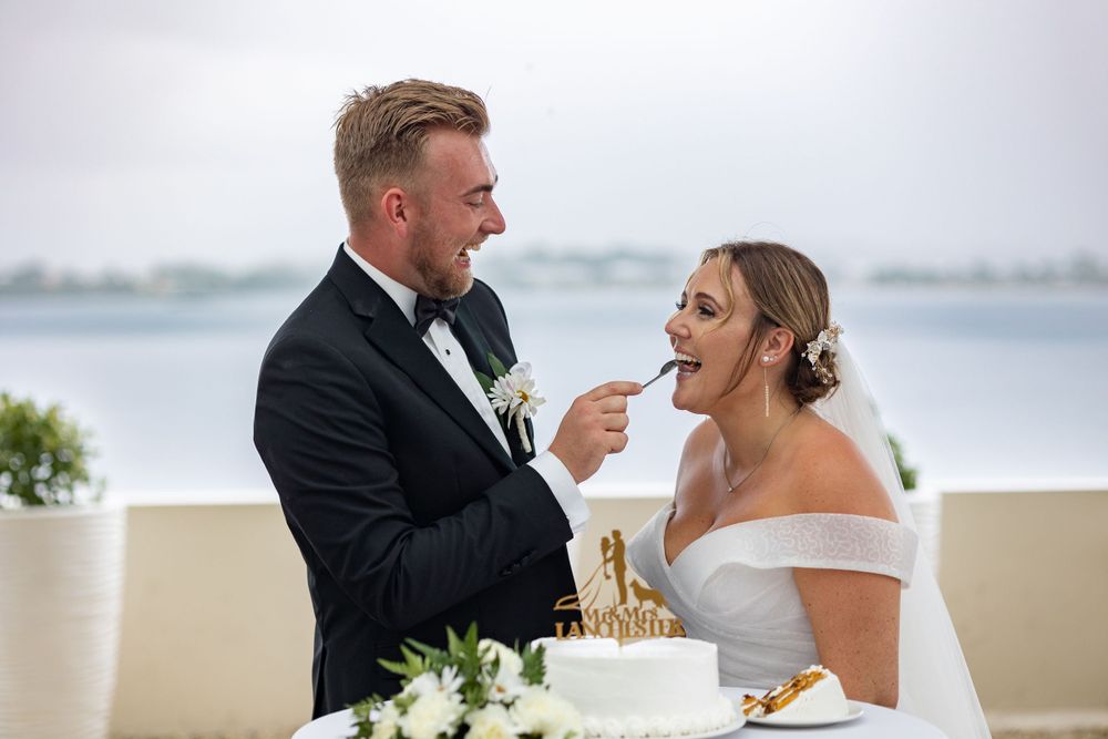 Bride and groom eating wedding cake