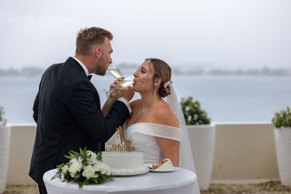 Bride and groom having champagne