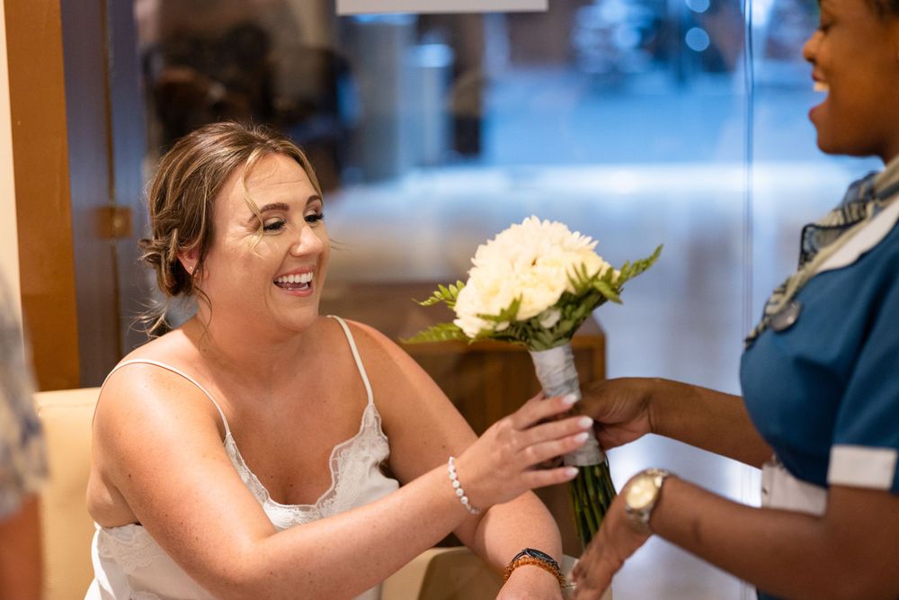 Bride receiving flowers