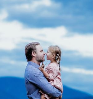 Dad gazes into daughters eyes