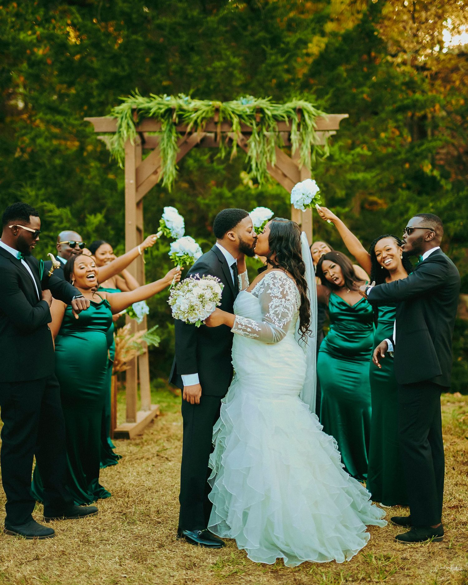 "Nigerian-Kenyan couple walking down the aisle at a garden wedding in Kansas City