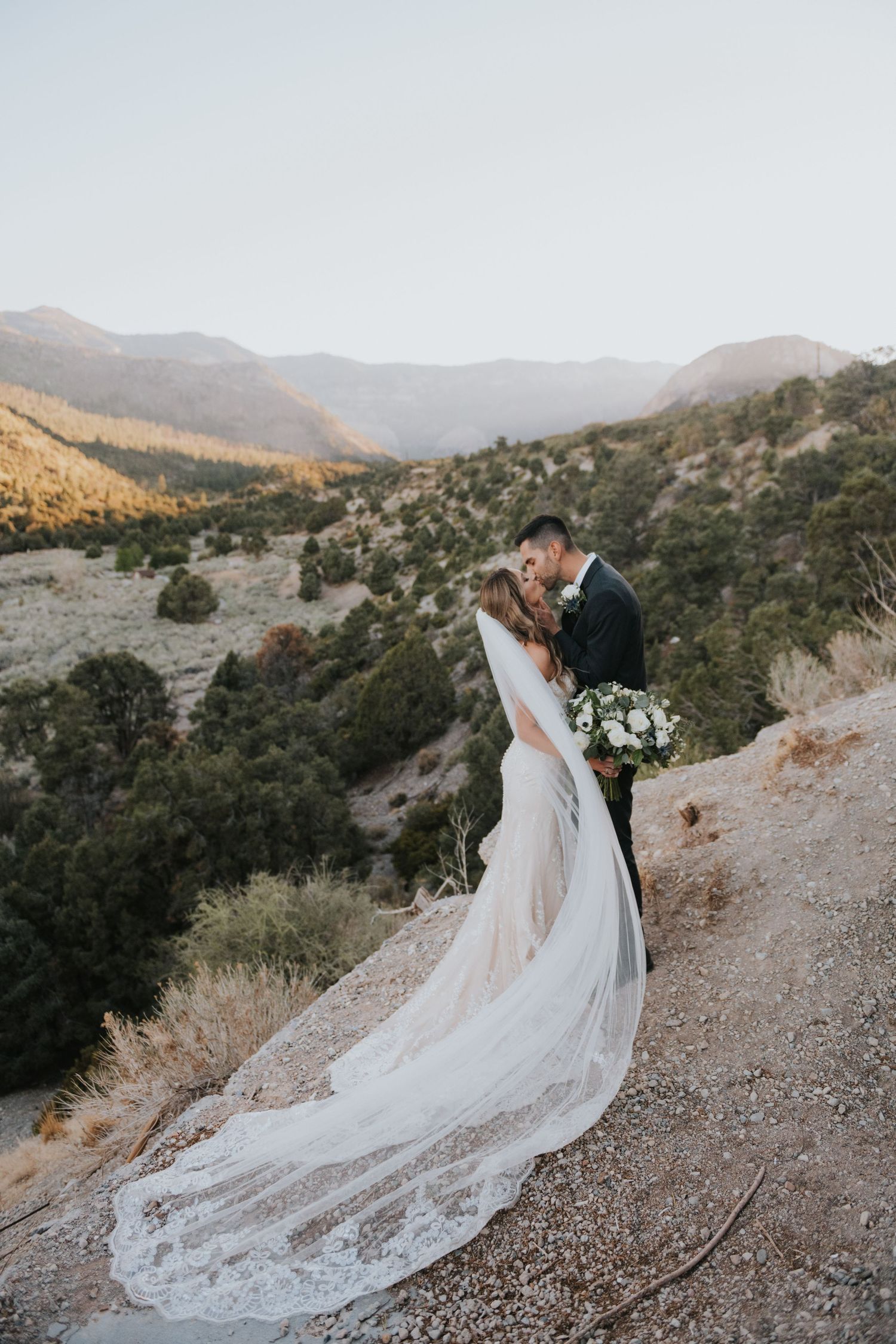 Bride and groom near an overlook in Mnt Charleston, Nevada during their destination wedding