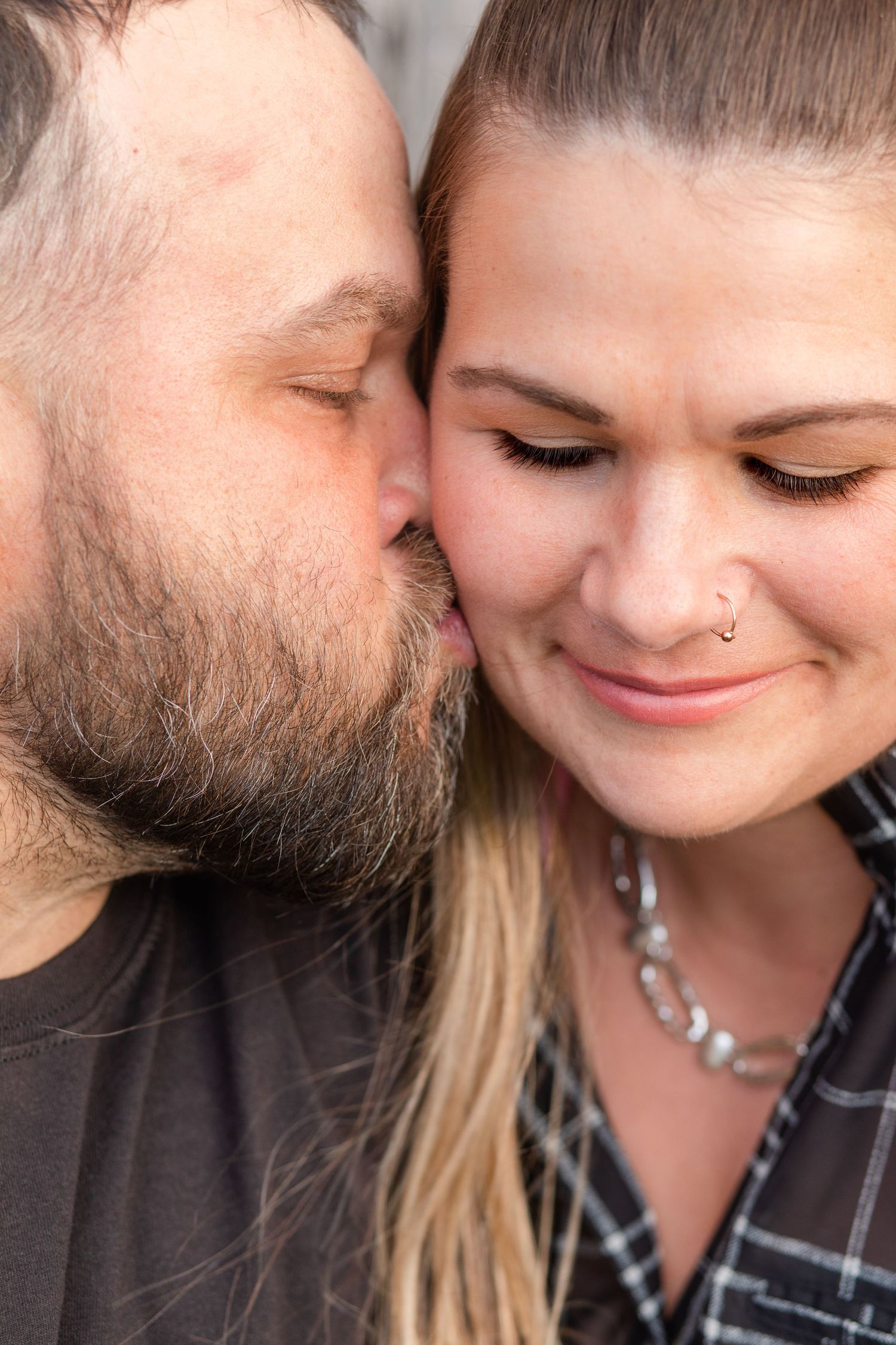 Close-up shots of an affectionate moment between a couple wearing casual attire.