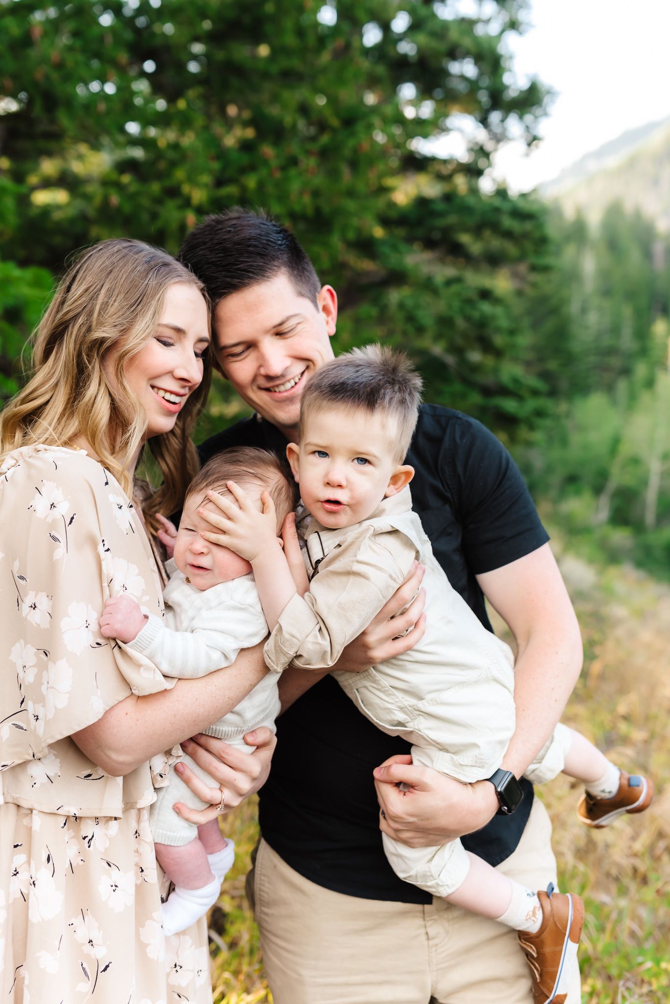 Intimate family moments captured in a series of outdoor photos with natural greenery.