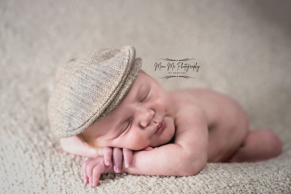 Professional studio photo of newborn baby boy