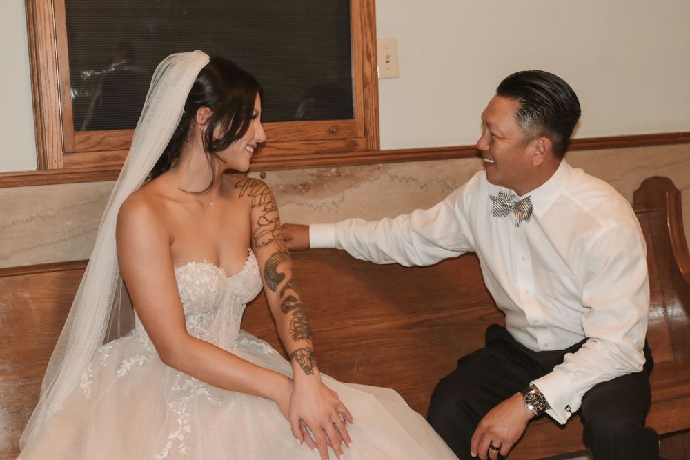 Candid moments between bride and wedding party members in an intimate indoor setting.