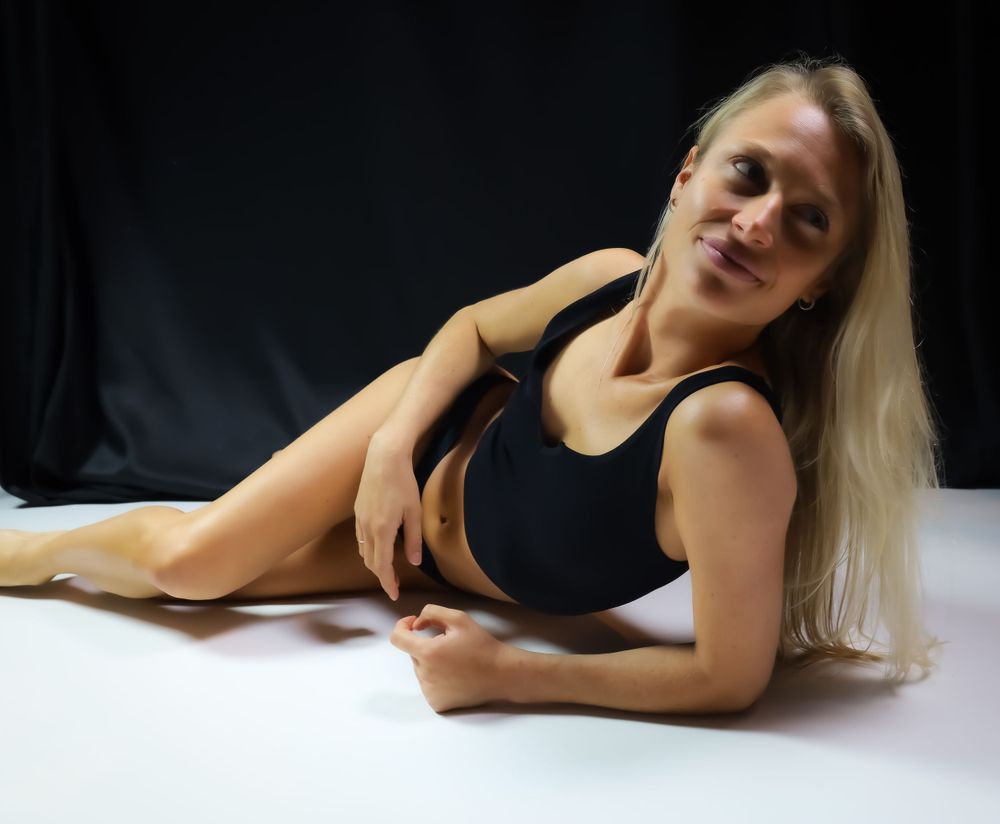 Artistic portrait series against dark background with dramatic lighting.