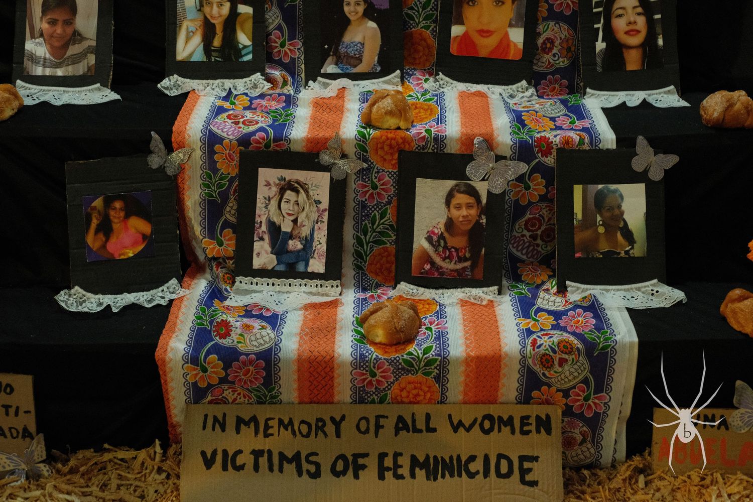 Memorial altar with photos and decorative elements commemorating victims.