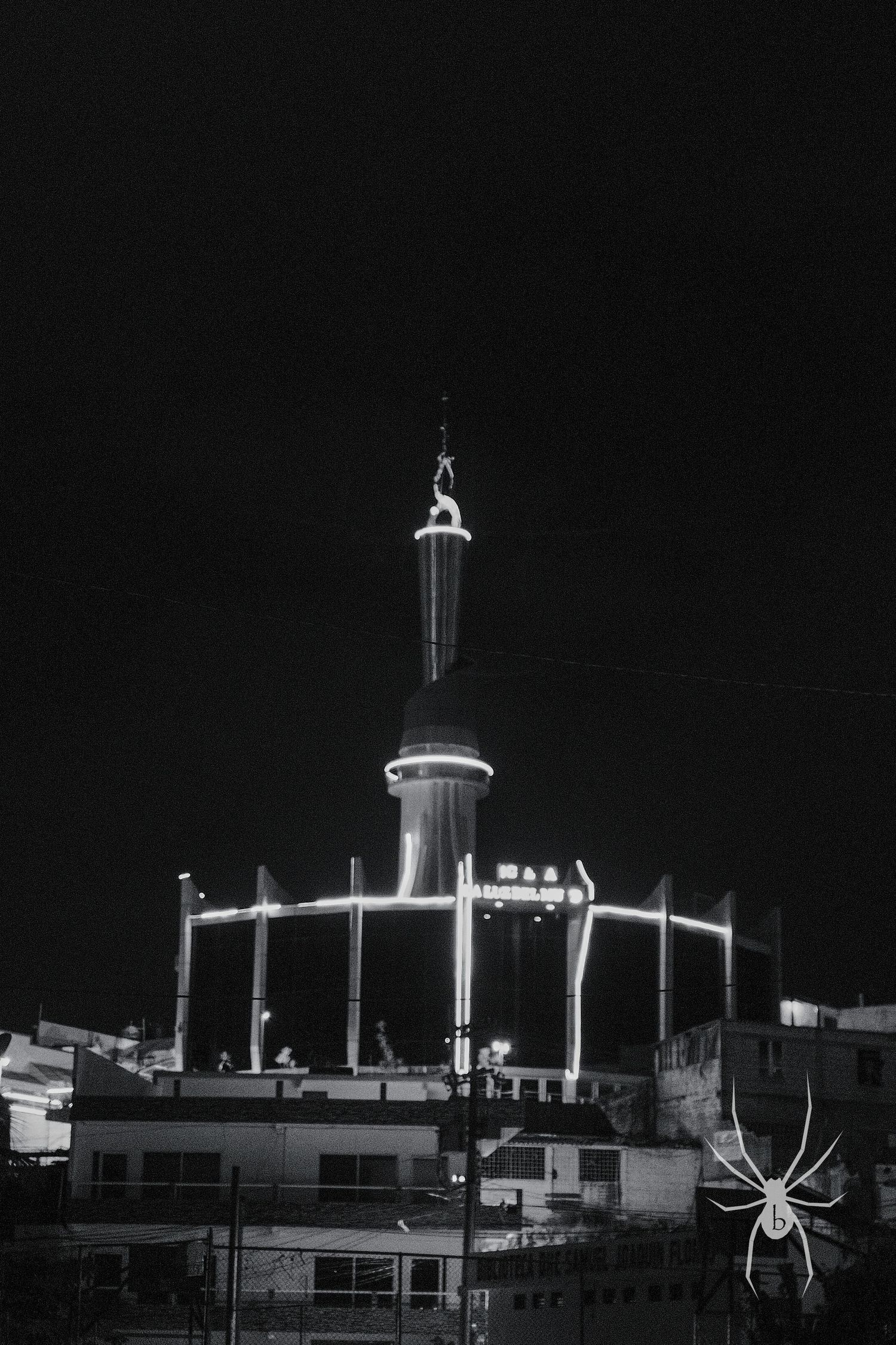 Black and white architectural photo of a tower with distinctive mid-century modern design.