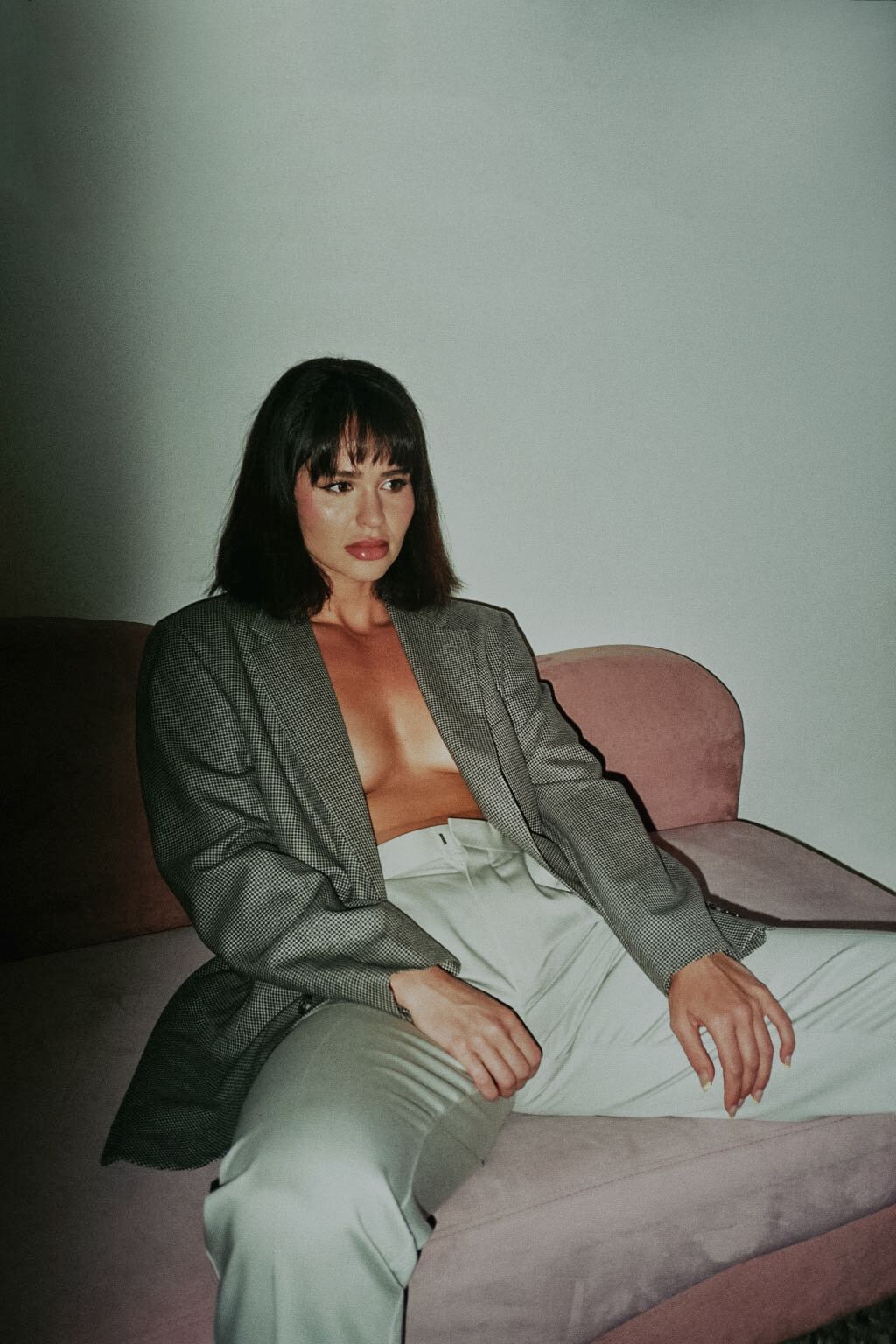 35mm film fashion portrait of woman in her home dressed in open blazer