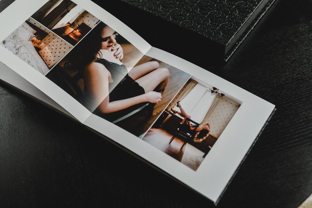 Professional wedding album spread with artistic photography layouts.