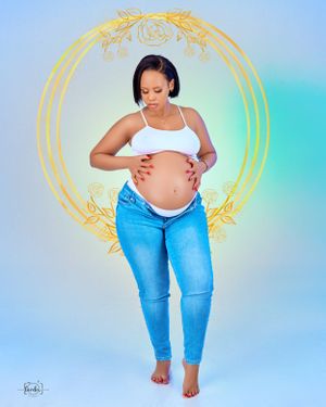 Maternity portrait with golden circular frame against gradient blue background.