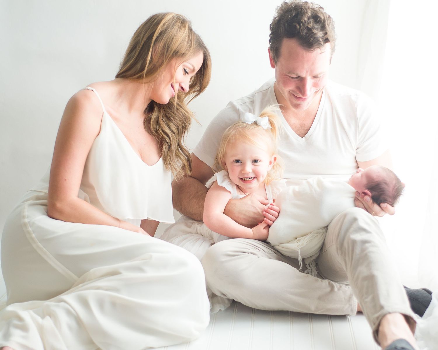 indoor white newborn session in an all white studio