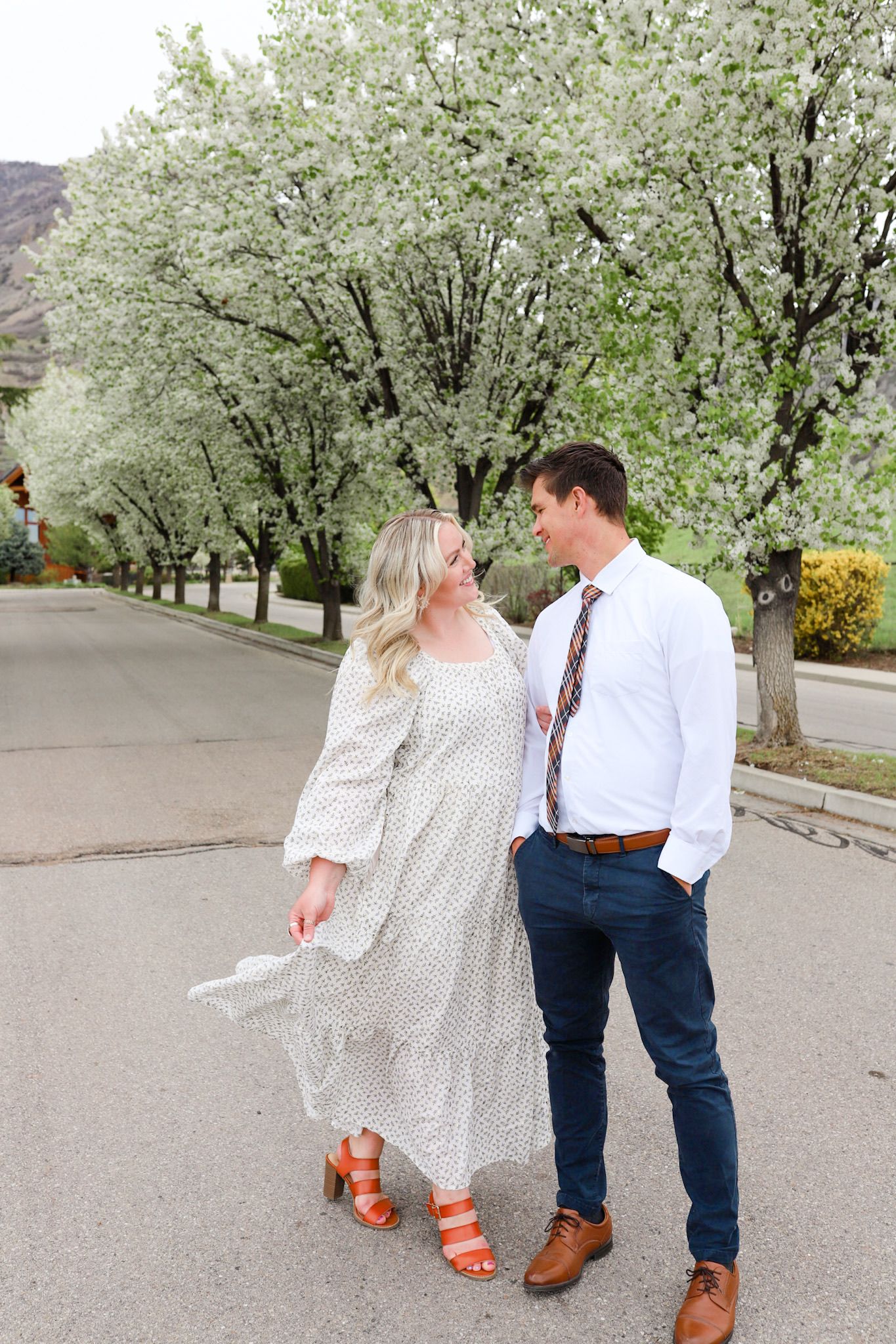 husband and wife enjoying the spring blossoms