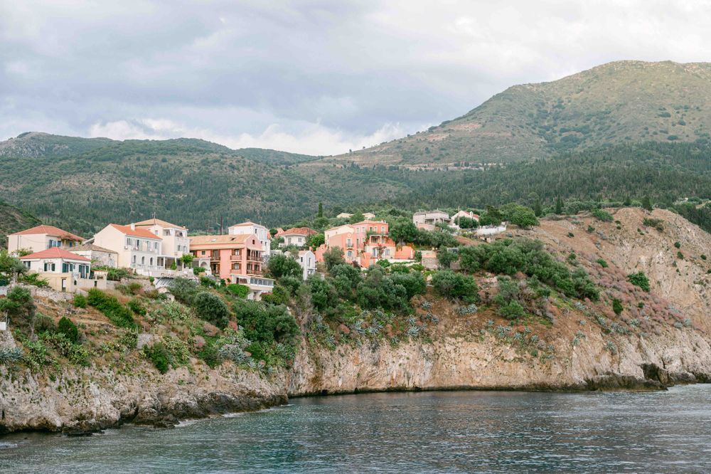 Mediterranean coastal homes perched on rocky cliffs overlooking the sea.