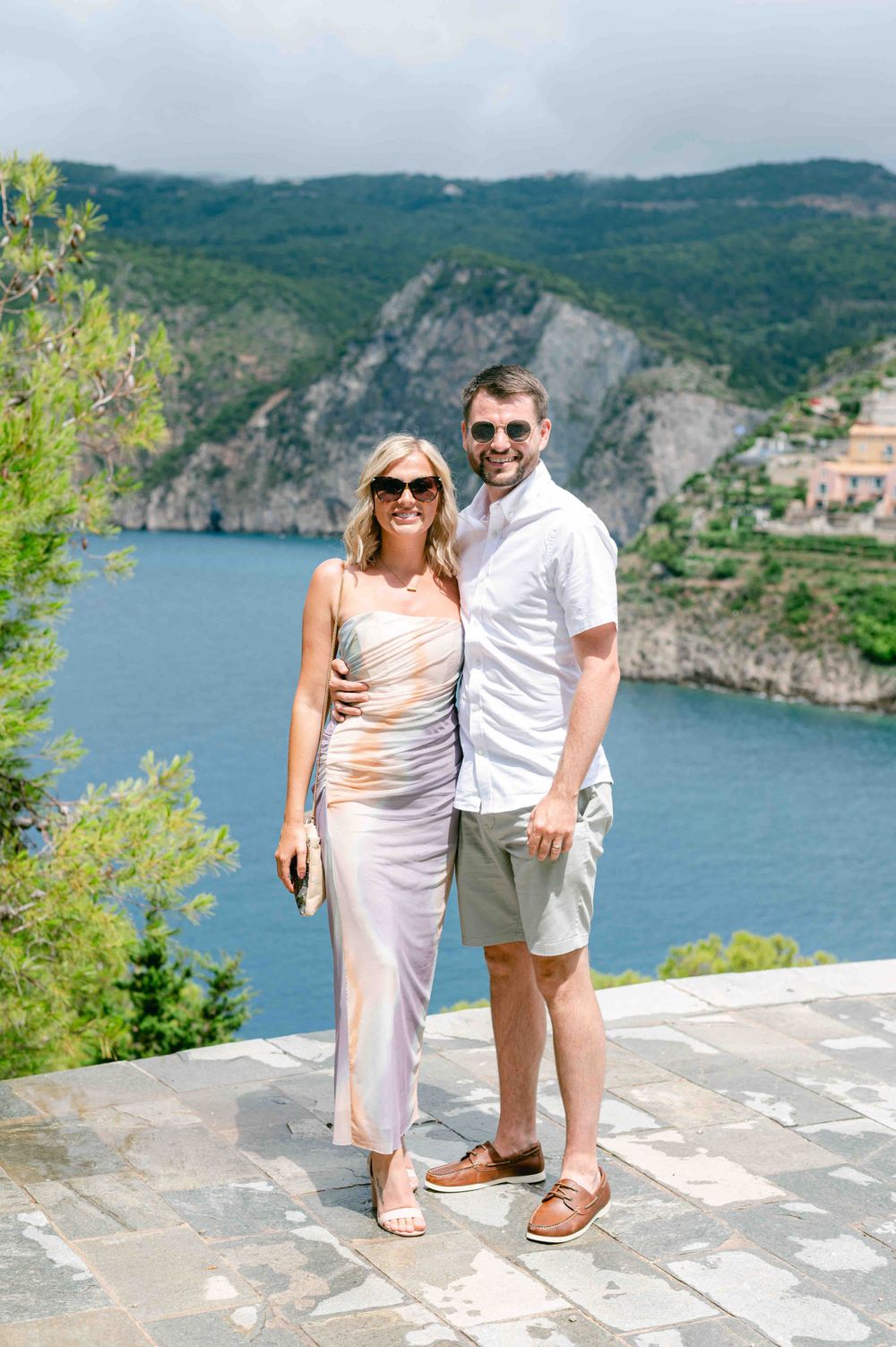 Scenic coastal view of Mediterranean cliffs and blue water from a stone terrace.