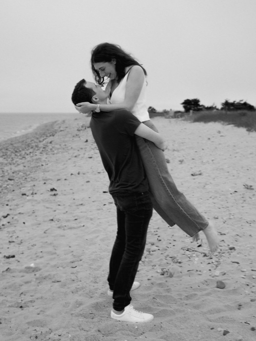 A celebratory spin on the beach after a marriage proposal.