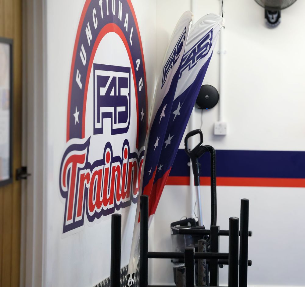 F45 Functional Training gym interior with branded wall mural and exercise equipment in the foreground.