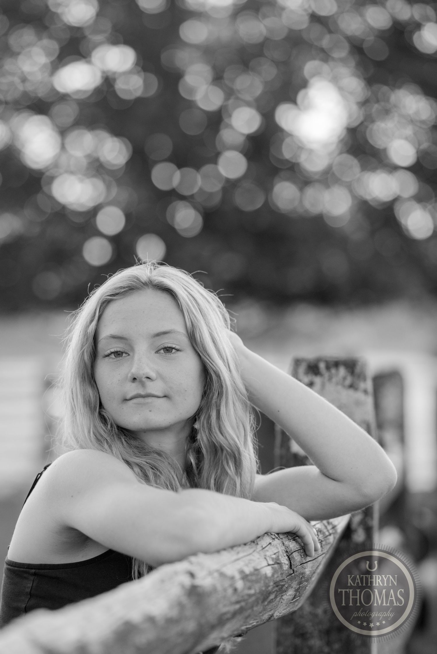 Artistic black and white portrait with dreamy bokeh background.