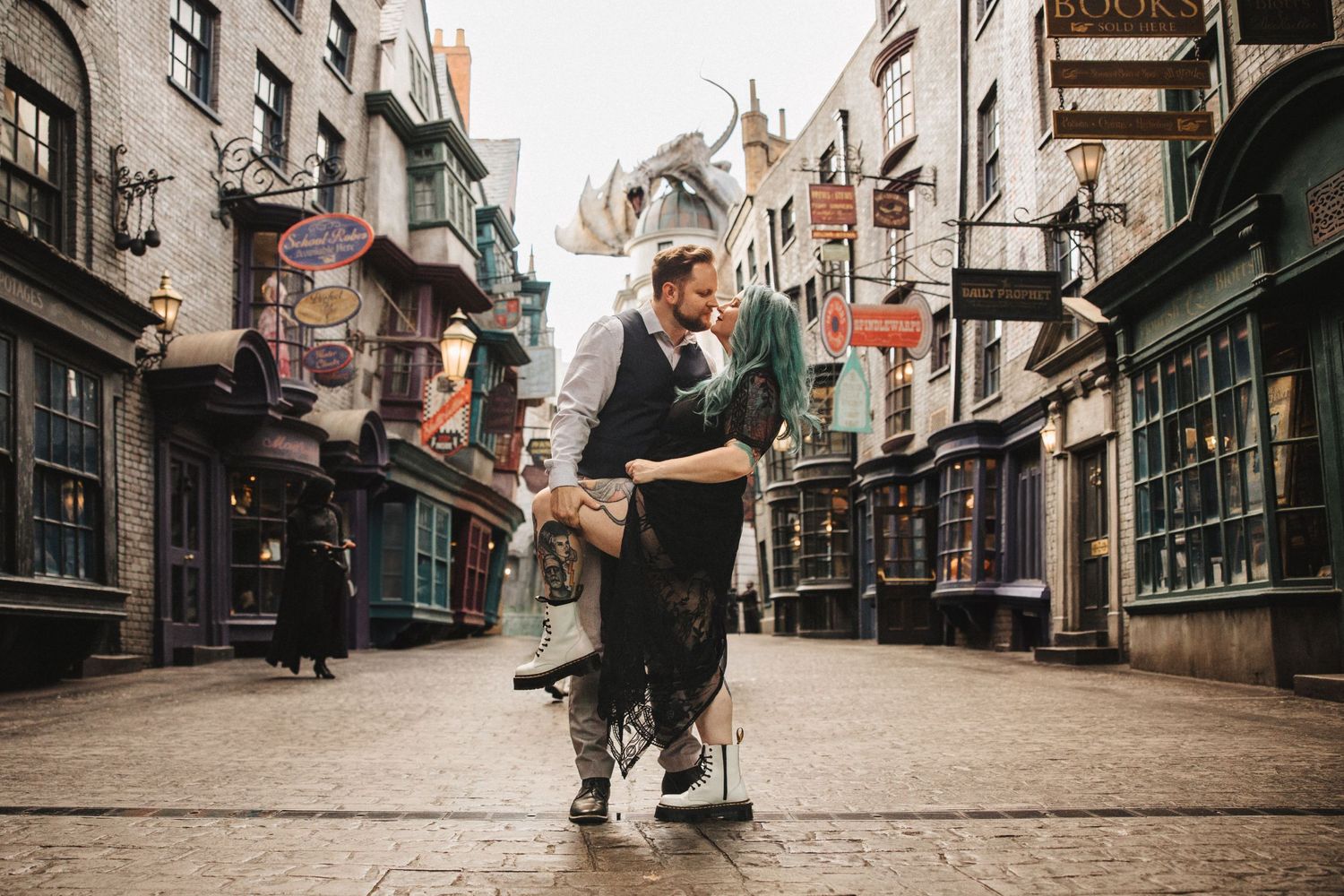 Romantic couple dancing in Diagon Alley at Universal Studios theme park.