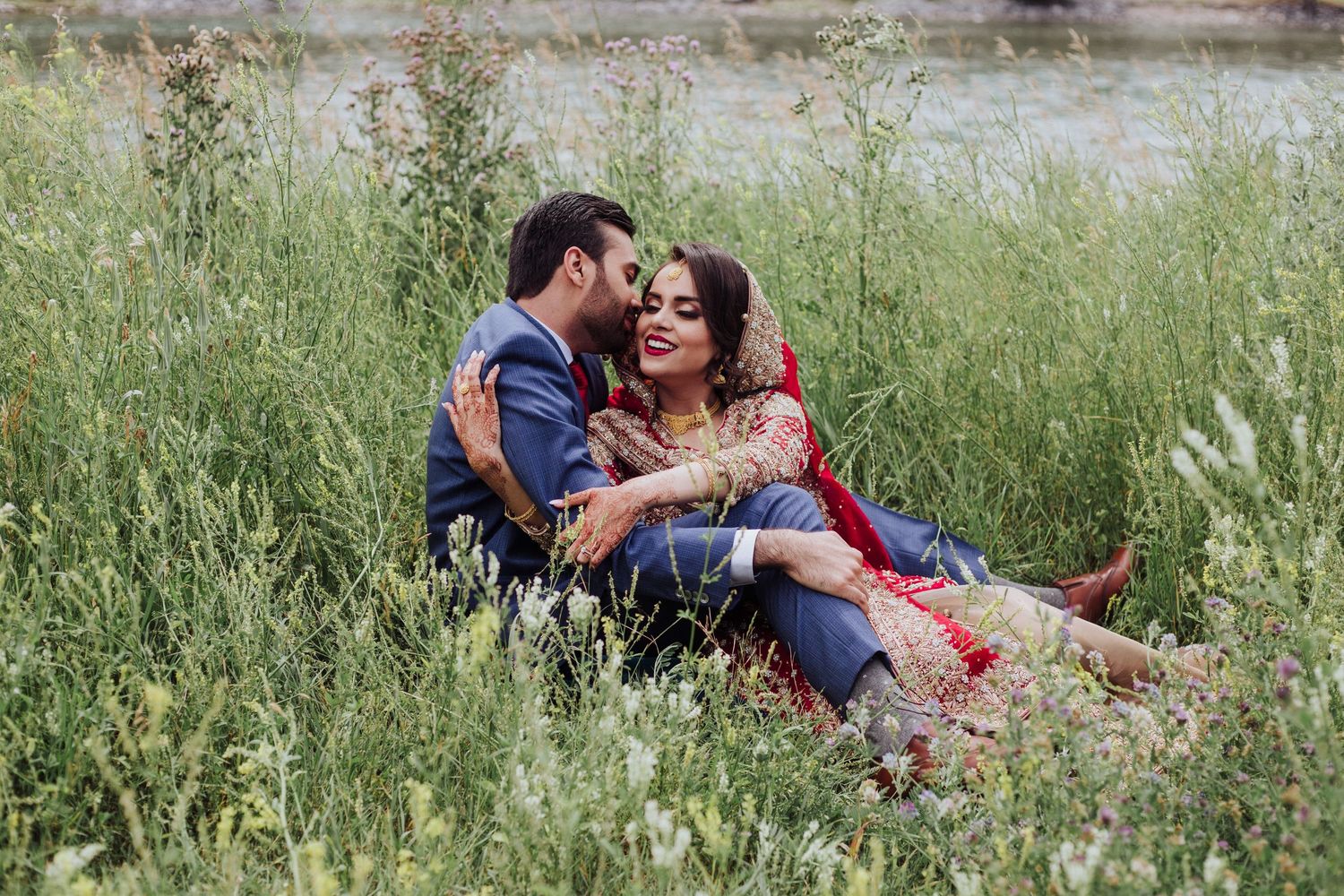 pakistani couple sitting by river