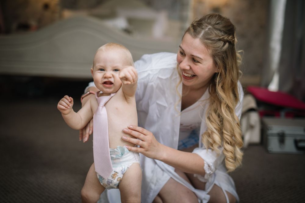 A joyful moment captured in an indoor setting with natural lighting.
