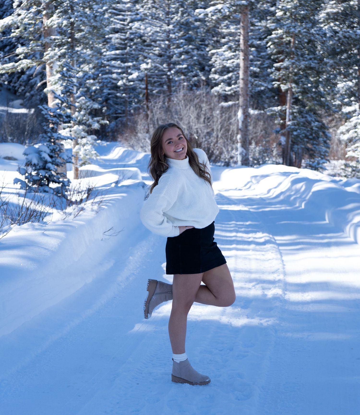 Image of woman in the snowy mountains. Taken at Silver Lake, Big Cottonwood Canyon, Utah.