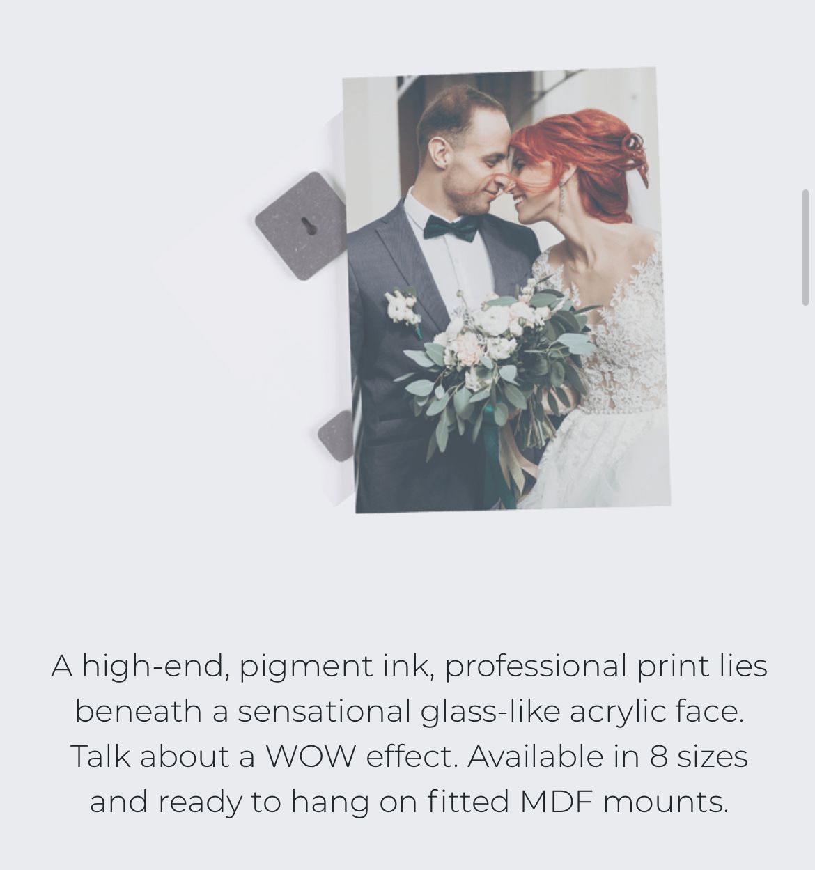 Wedding photo mounted under glass-like acrylic with white bouquet and professional finish.