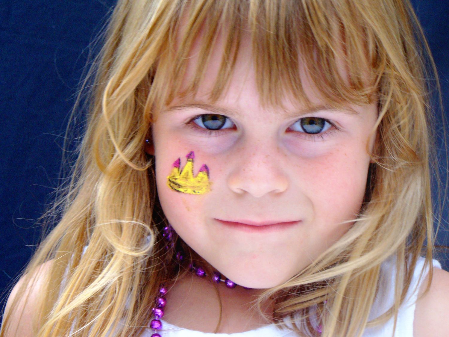 Young Girl with princess castle painted on cheek