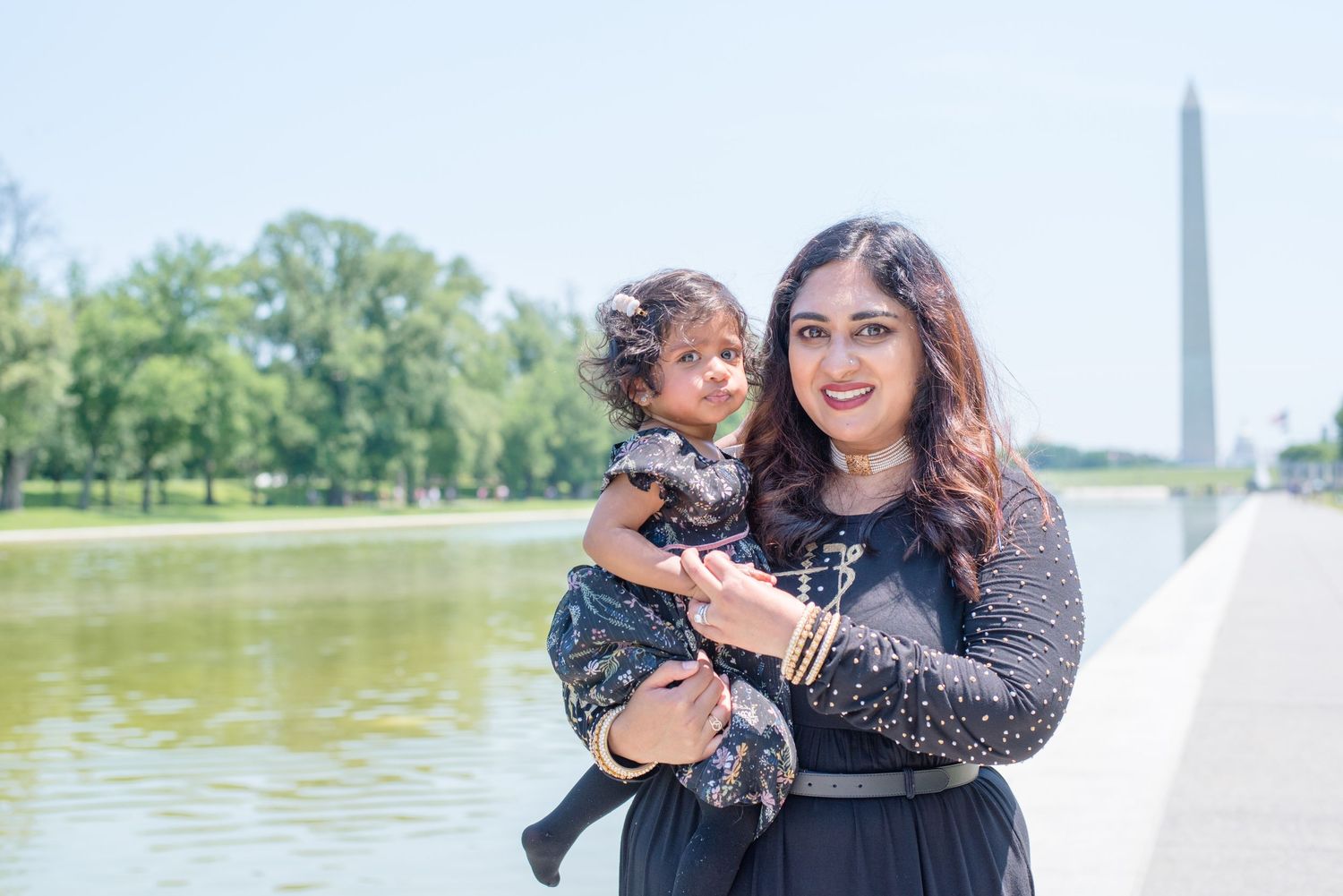 square image of mom holding her daughter