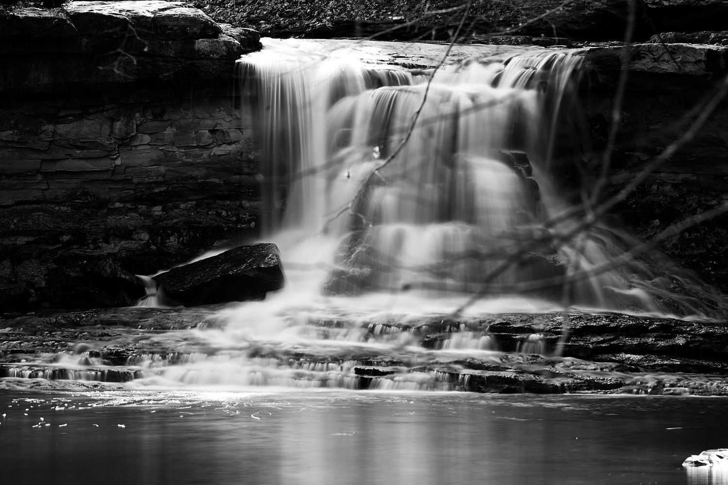 A long exposure black and white photo of the waterfall at McCormick's Creek State Park in Spencer, Indiana.