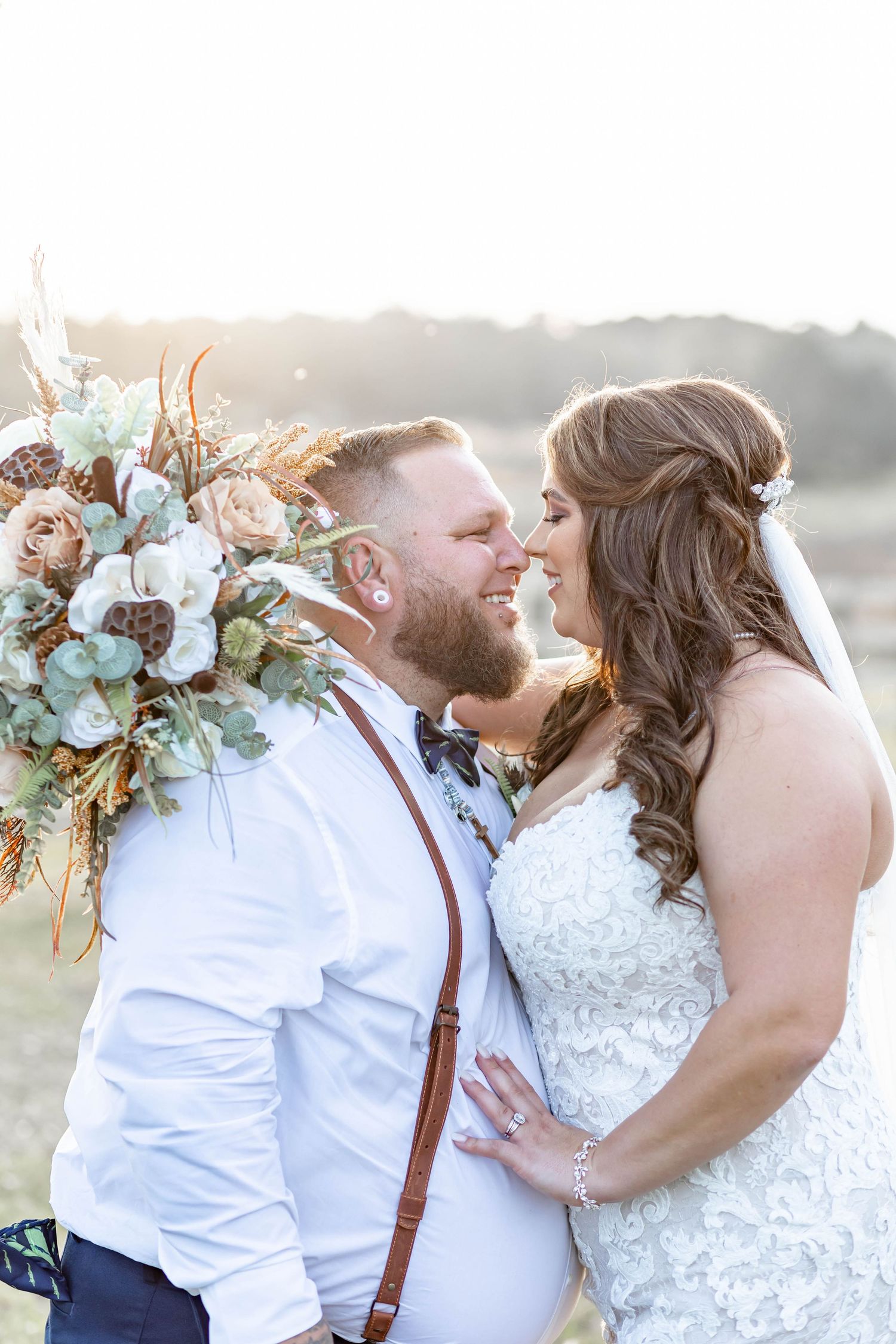 bride and groom go in for a kiss at the White Magnolia in Kentwood, LA