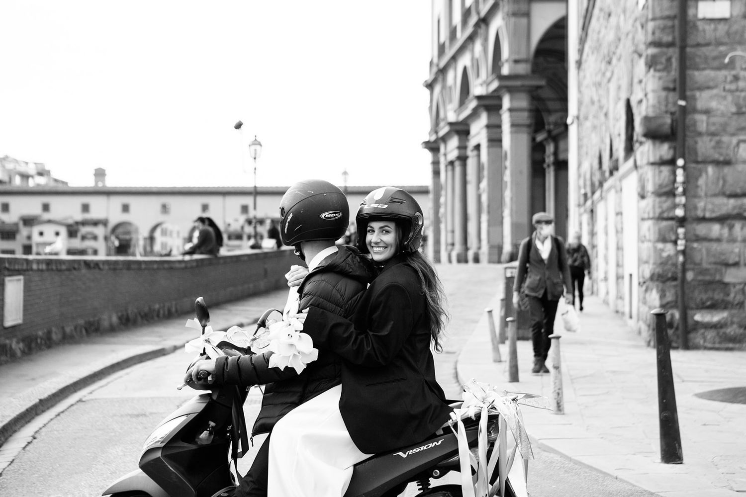 bride and groom on a moped following their elopement in Florence captured by wedding photographer Elizabeth Armitage