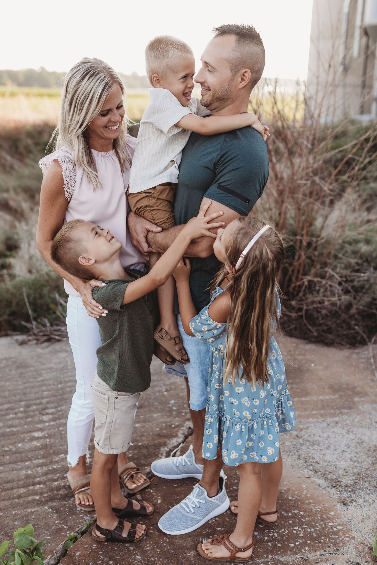 Family snuggles each other at a farm in Landisville Pennsylvania for their family photo shoot