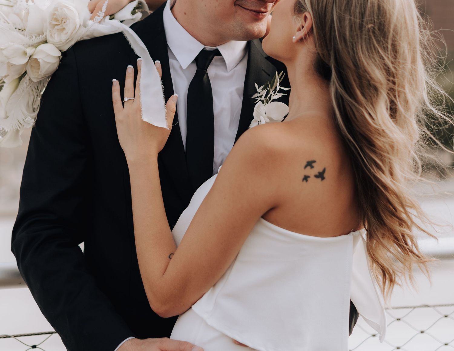 Close-up of romantic wedding moment with delicate details.