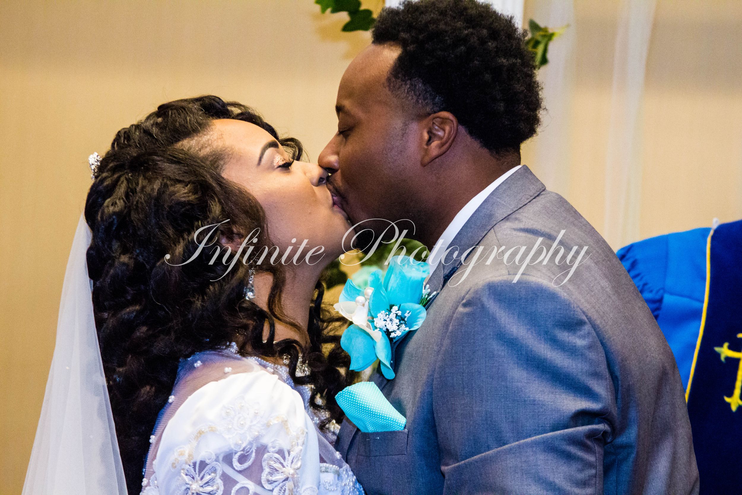 Romantic moment captured between couple in formal wedding attire.