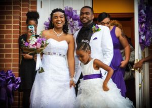 A joyful wedding celebration with purple decorations and decor.