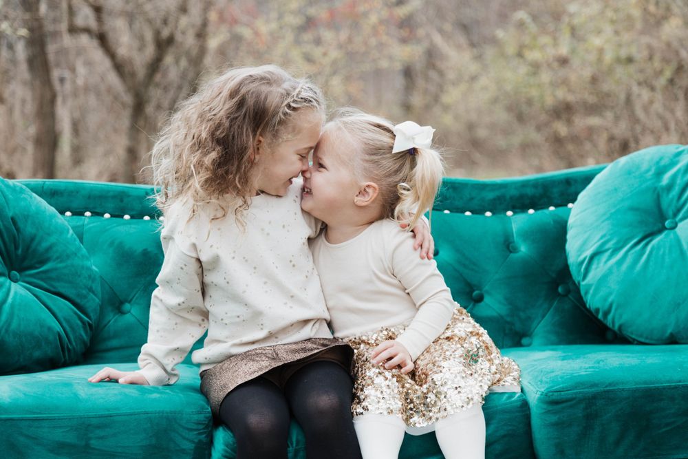 Siblings sharing a laugh in outdoor photo
