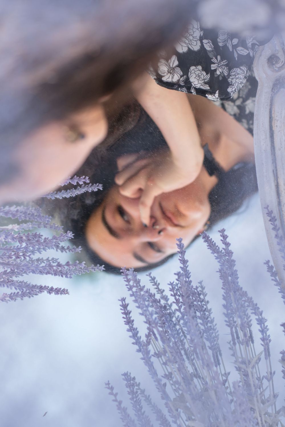 An artistic overhead shot with lavender flowers creating a dreamy frame.