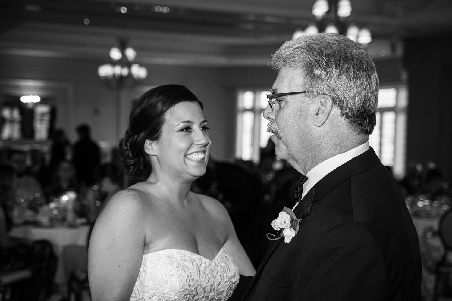 Black and white wedding reception photos showing intimate moments on the dance floor.