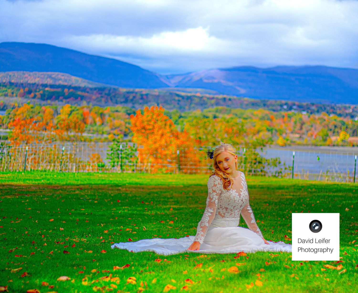Beautiful autumn landscape with vibrant fall foliage and rolling mountains in the background.