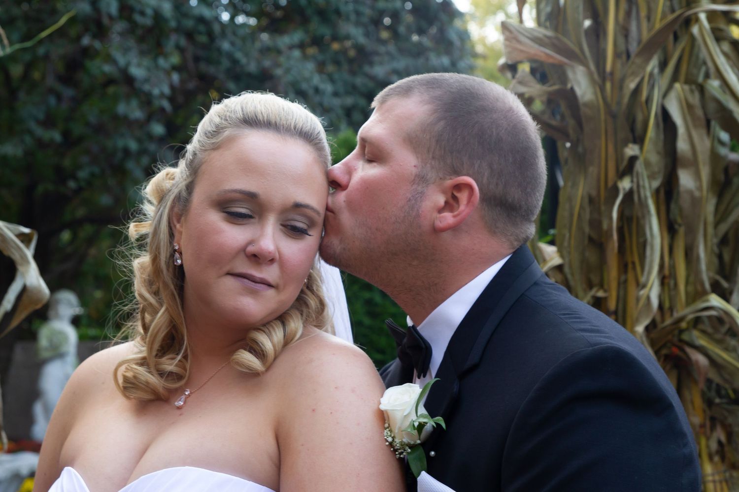 A series of intimate wedding photos taken near a cornfield at sunset.
