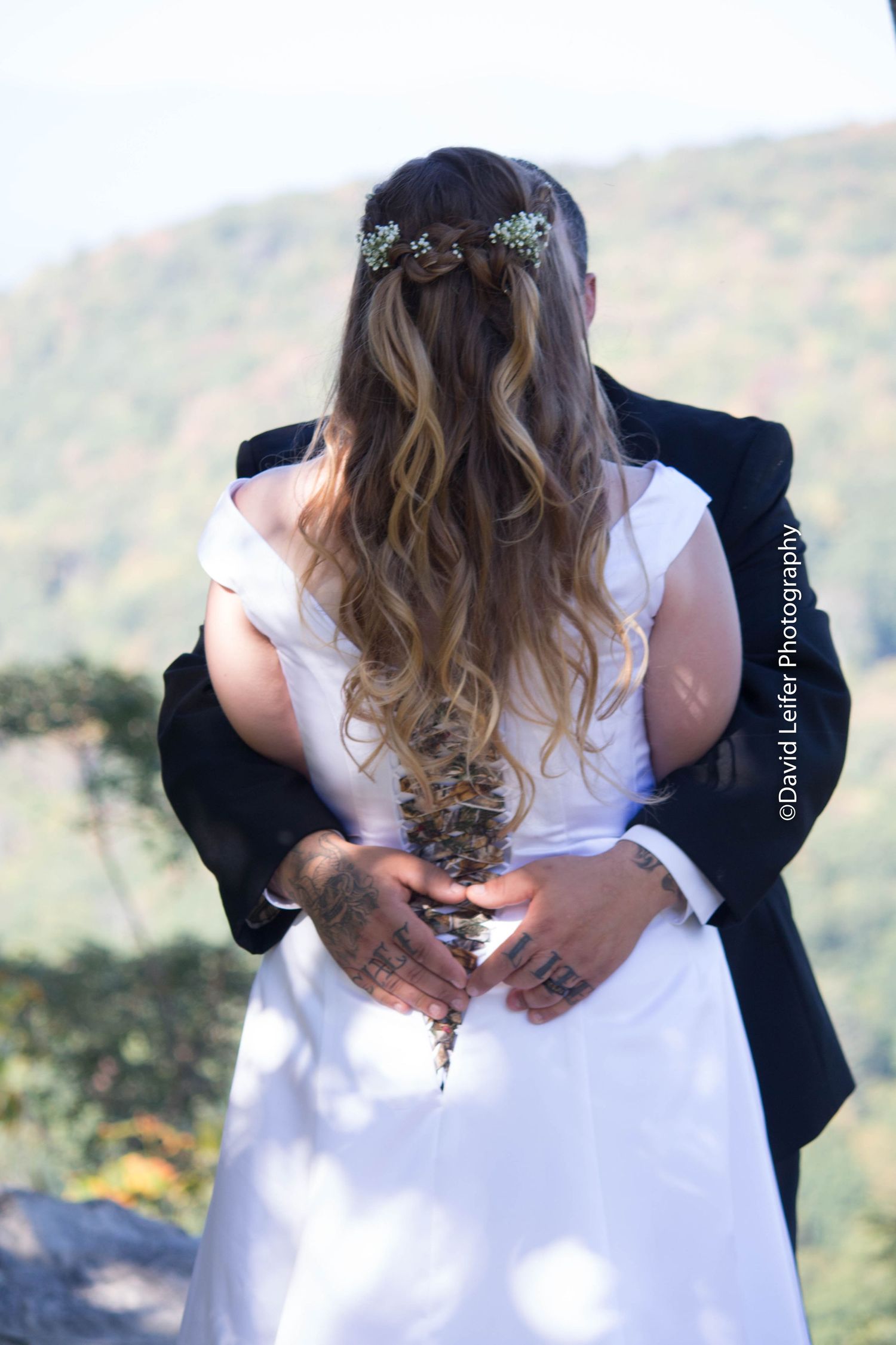 A series of romantic embraces captured against a mountain backdrop.