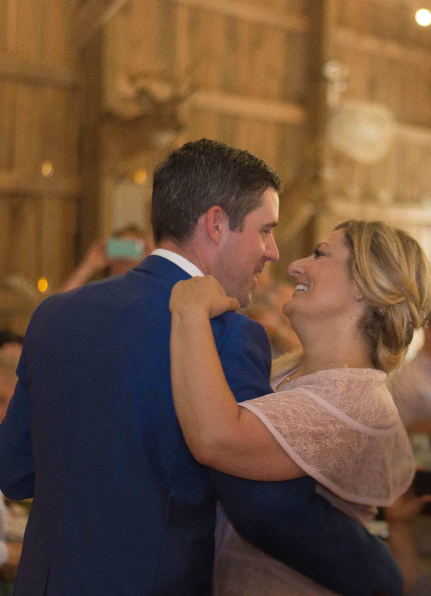 Romantic dance sequence in an elegant venue with warm lighting.